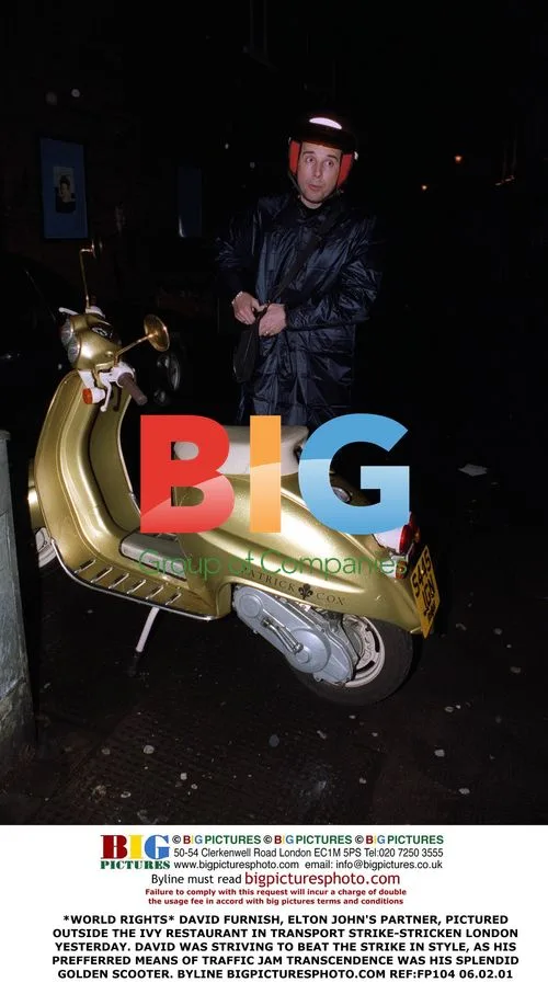 David Furnish Beats Transport Strike on Scooter