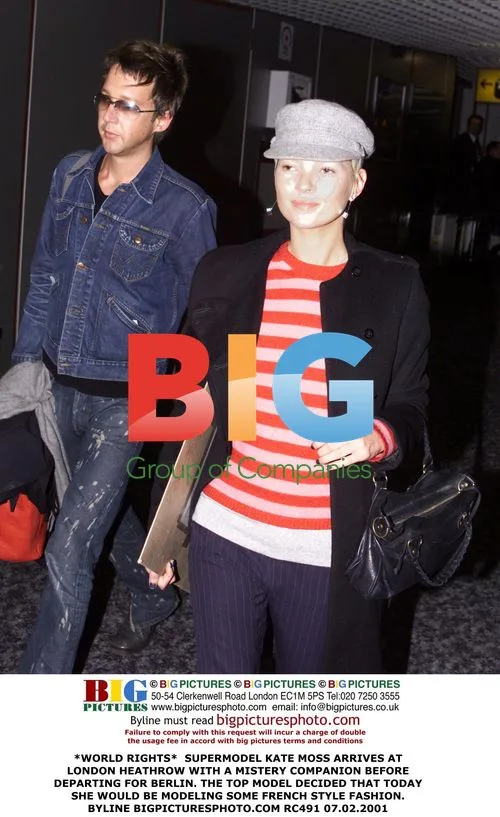 Kate Moss Arrives at Heathrow