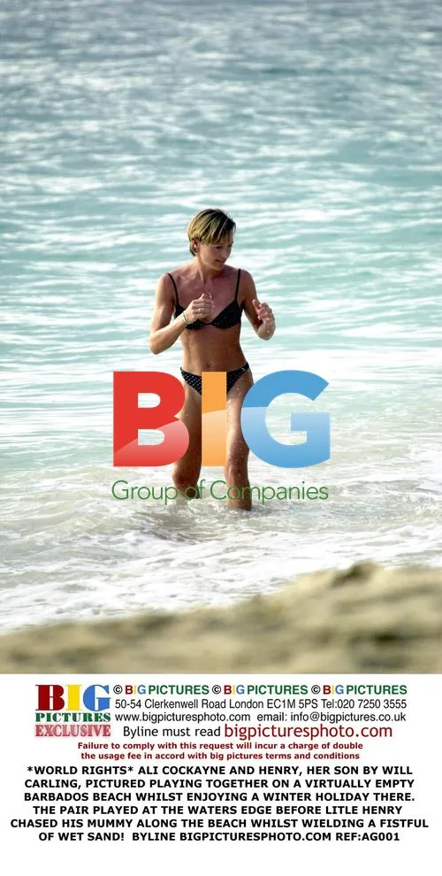 Ali Cockayne and son Henry play on Barbados beach