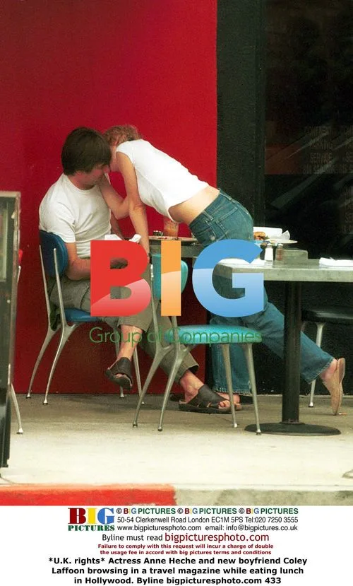 Actress Anne Heche and boyfriend browsing travel magazine