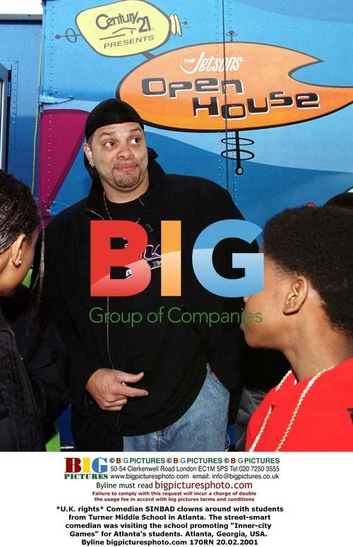 Comedian Sinbad clowns with students in Atlanta