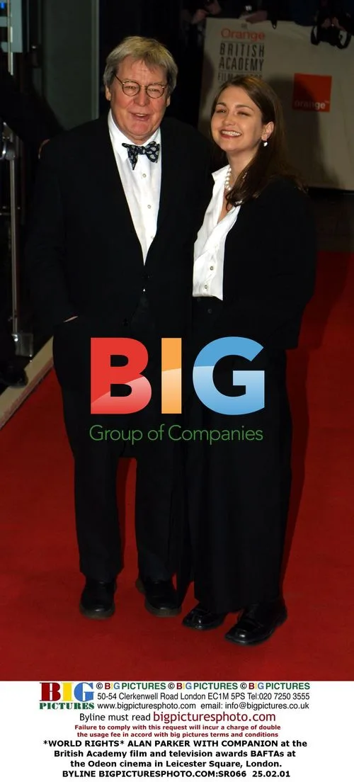 ALAN PARKER WITH COMPANION at BAFTA Awards