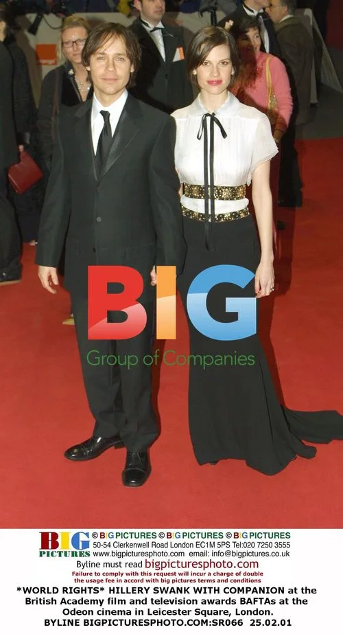 HILLERY SWANK WITH COMPANION at 2001 BAFTA Awards