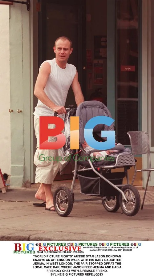 Jason Donovan and baby daughter Jemma out in London