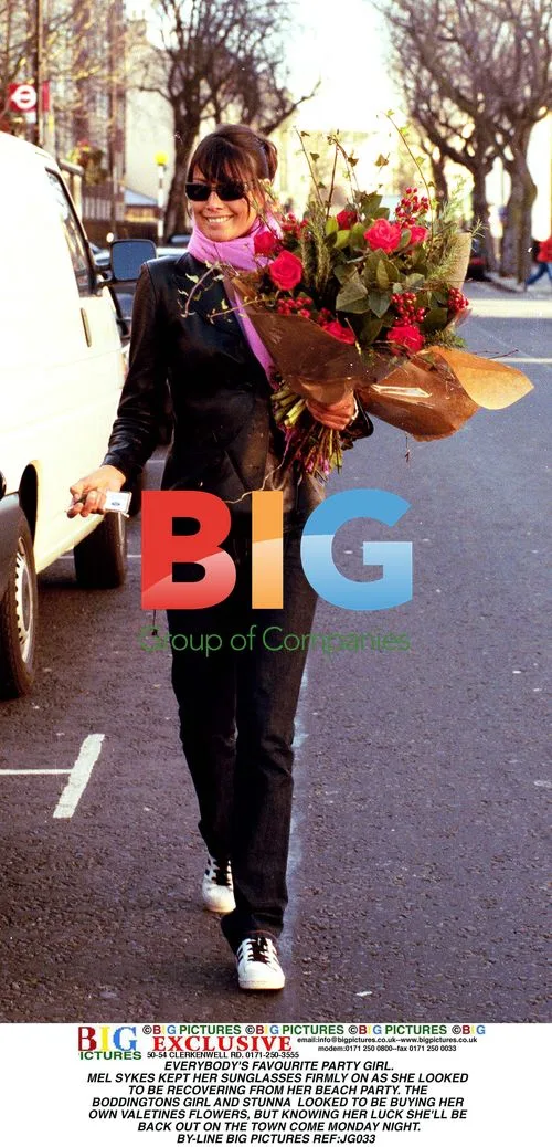 Mel Sykes Buys Flowers