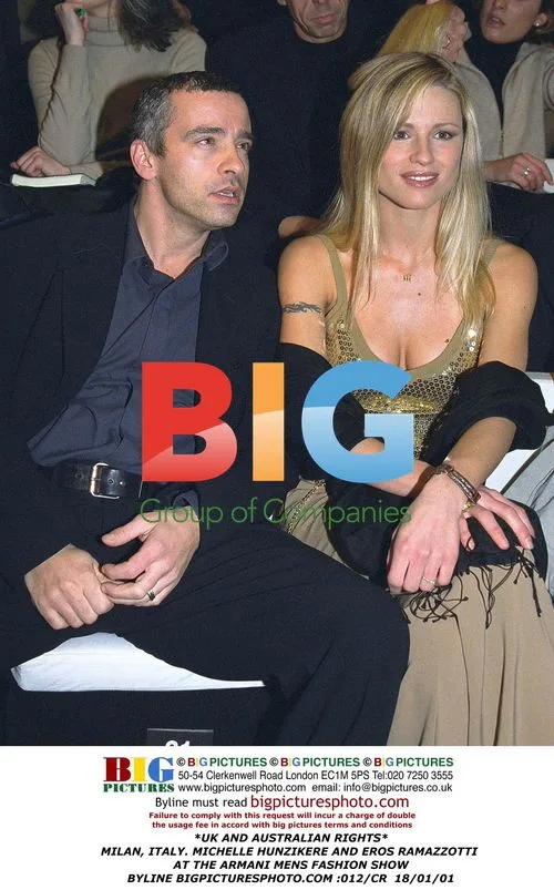 Michelle Hunziker and Eros Ramazzotti at Armani Men's Show