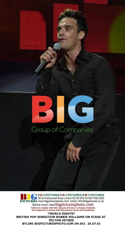 Robbie Williams Performs on Stage
