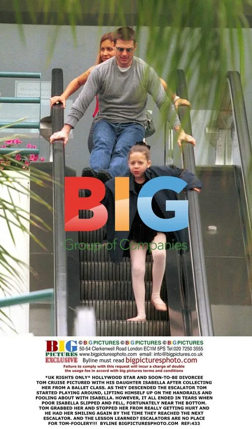 Tom Cruise Plays with Daughter on Escalator