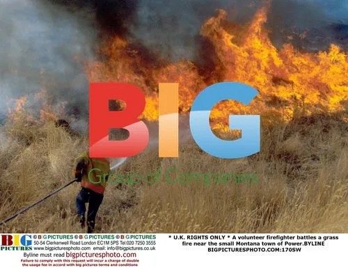 Firefighter battles grass fire in Montana