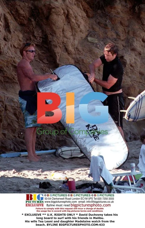David Duchovny surfs with friends in Malibu