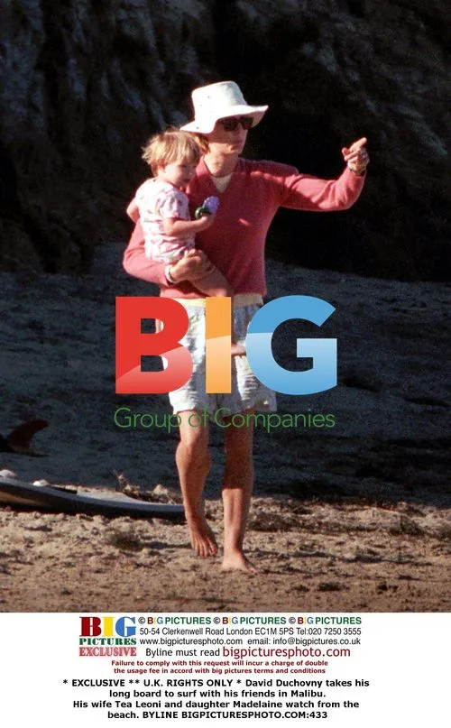 David Duchovny surfs with friends in Malibu
