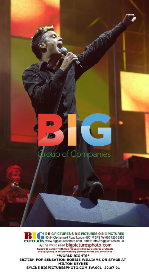 Robbie Williams Performs on Stage in Milton Keynes