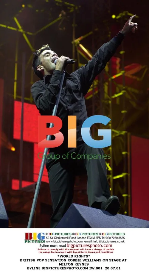 Robbie Williams Performs on Stage in Milton Keynes