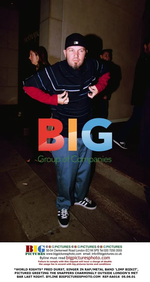 Fred Durst Greets Photographers Outside London Bar