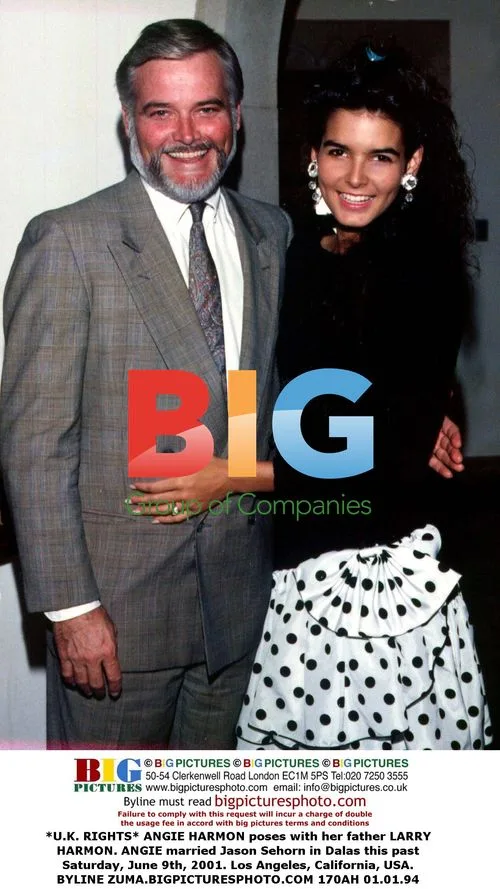 Angie Harmon poses with father Larry