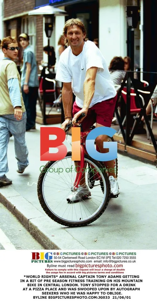 Arsenal Captain Tony Adams Rides Bike in London