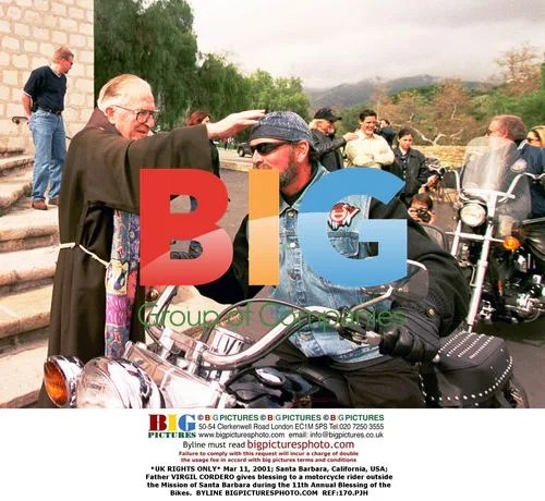 Father Virgil Cordero blesses motorcycle rider in Santa Barbara