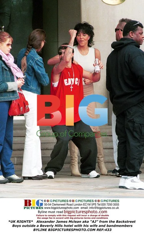 AJ from Backstreet Boys with bandmates and wife