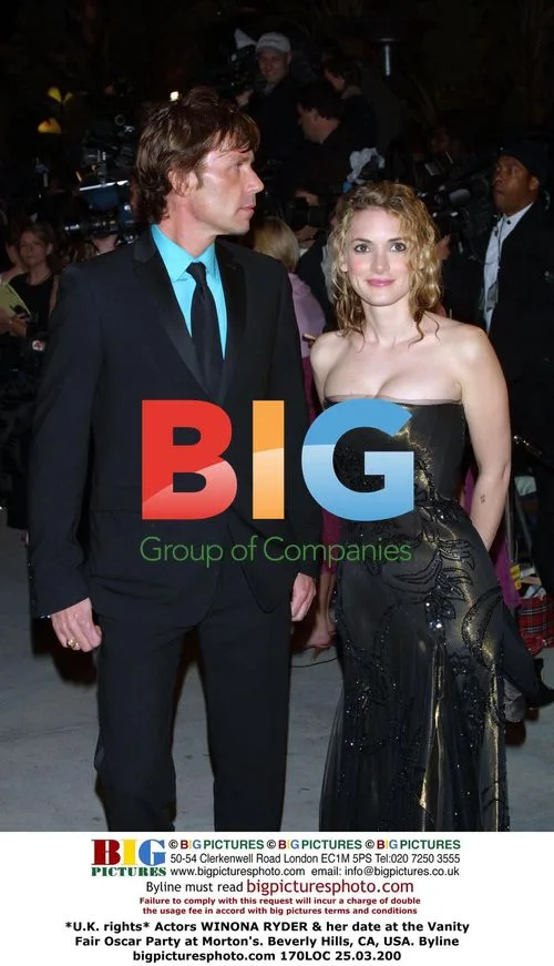 Winona Ryder and date at Vanity Fair Oscar Party