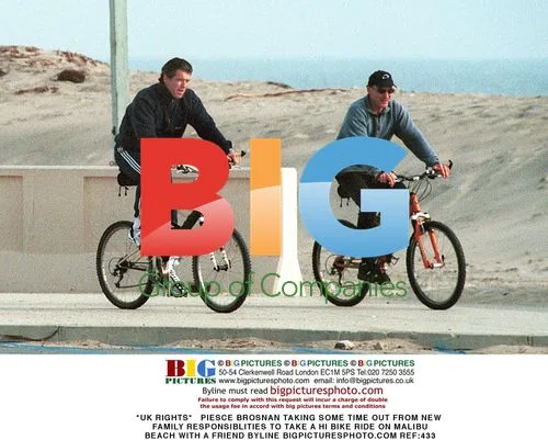 Pierce Brosnan Bikes with Friend on Malibu Beach
