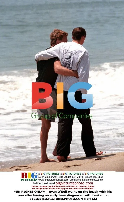 Ryan O'Neil and son on beach after Leukemia diagnosis