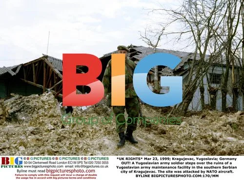 Yugoslavian Soldier Amid Facility Ruins