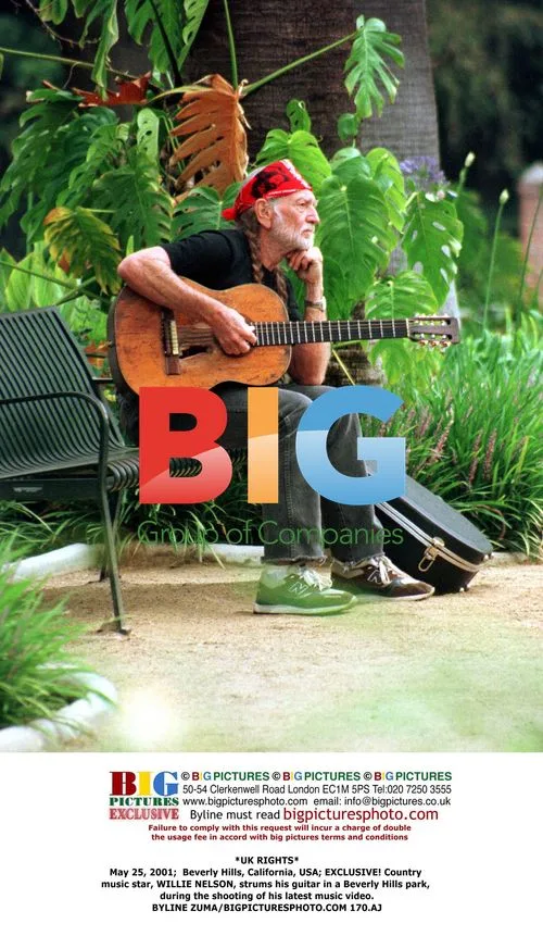 Willie Nelson strums guitar in Beverly Hills