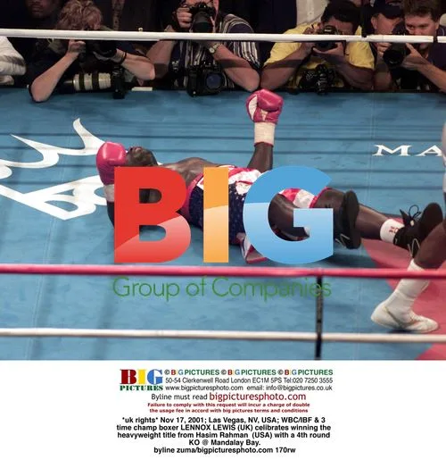 Lennox Lewis wins heavyweight title