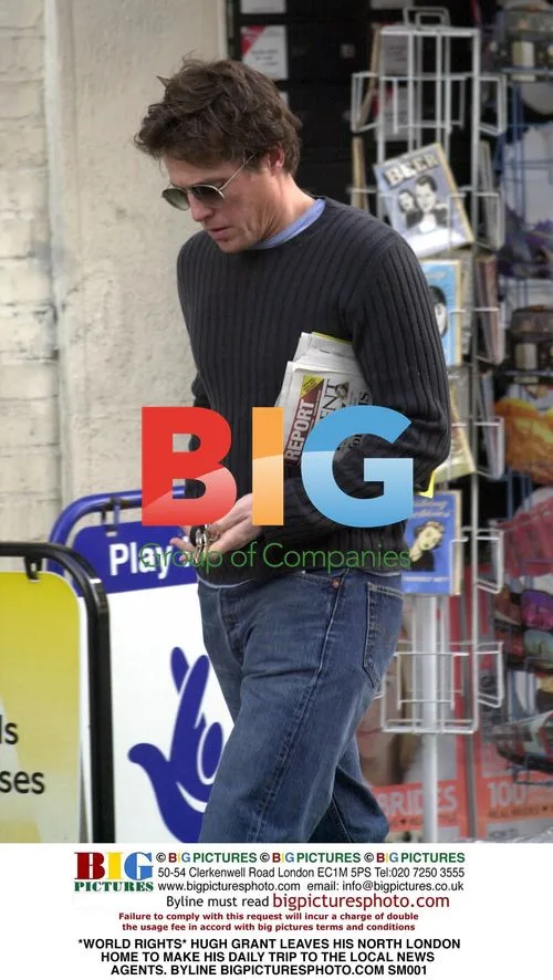 Hugh Grant Leaves North London Home