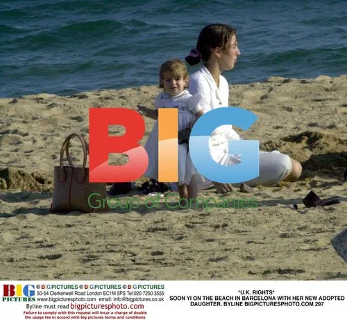 Soon Yi on Beach with Adopted Daughter