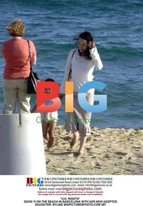 Soon Yi on Beach in Barcelona with Adopted Daughter