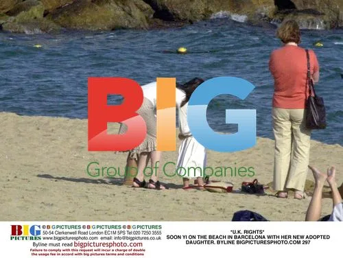 Soon Yi on Barcelona Beach With Adopted Daughter