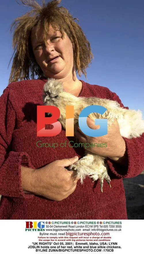 LYNN JOSLIN holds a silkie chicken