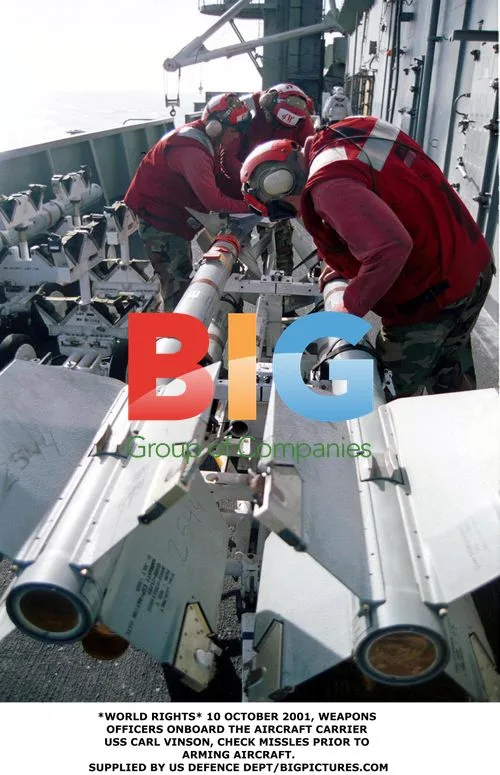 Weapons Officers Check Missiles on USS Carl Vinson