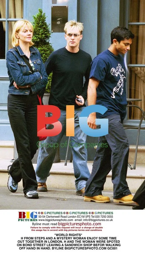 H from Steps and mystery woman spotted in London