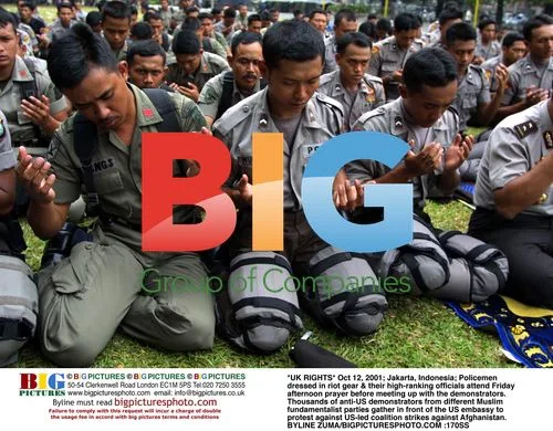Indonesian Policemen Attend Friday Prayer