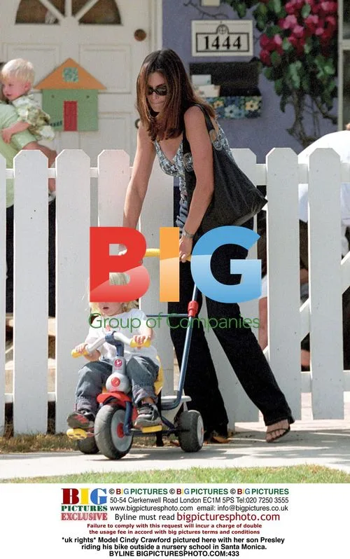 Cindy Crawford and son Presley bike outside school