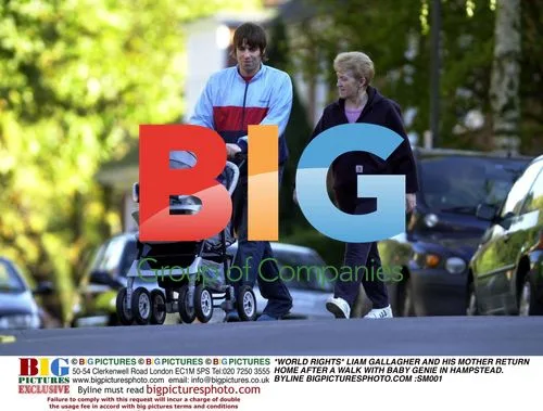 Liam Gallagher and mother walk with baby Genie