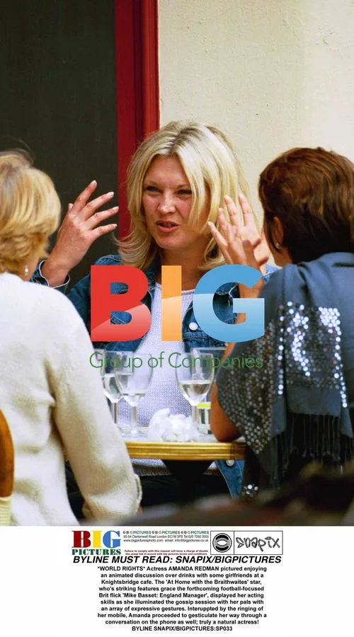 Amanda Redman Enjoys Animated Cafe Chat with Friends