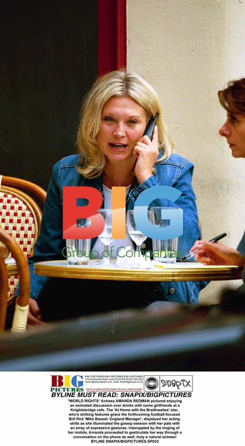 Amanda Redman Enjoys Animated Chat with Friends