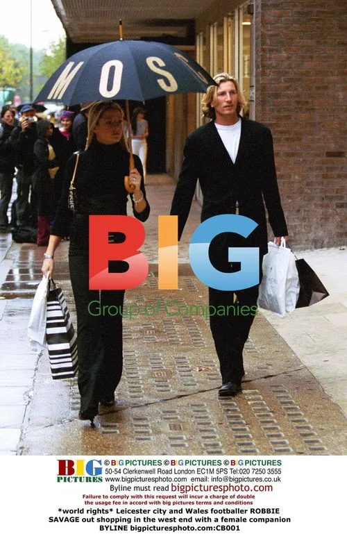 Footballer Robbie Savage shopping with female companion