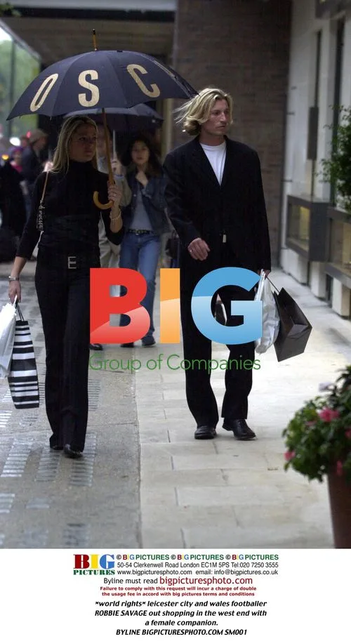 Robbie Savage shopping with female companion