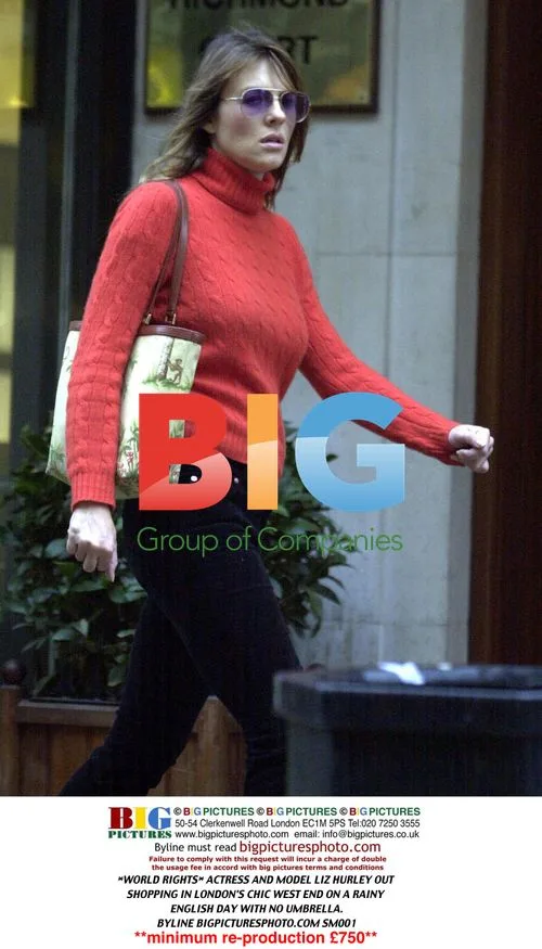 Liz Hurley Shopping in London on Rainy Day