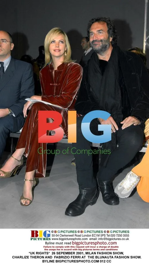 Charlize Theron and Fabrizio Ferri at Milan Fashion Show