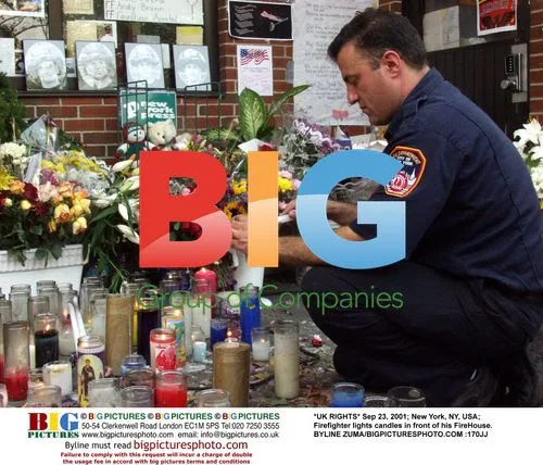 Firefighter Lights Candles at FireHouse