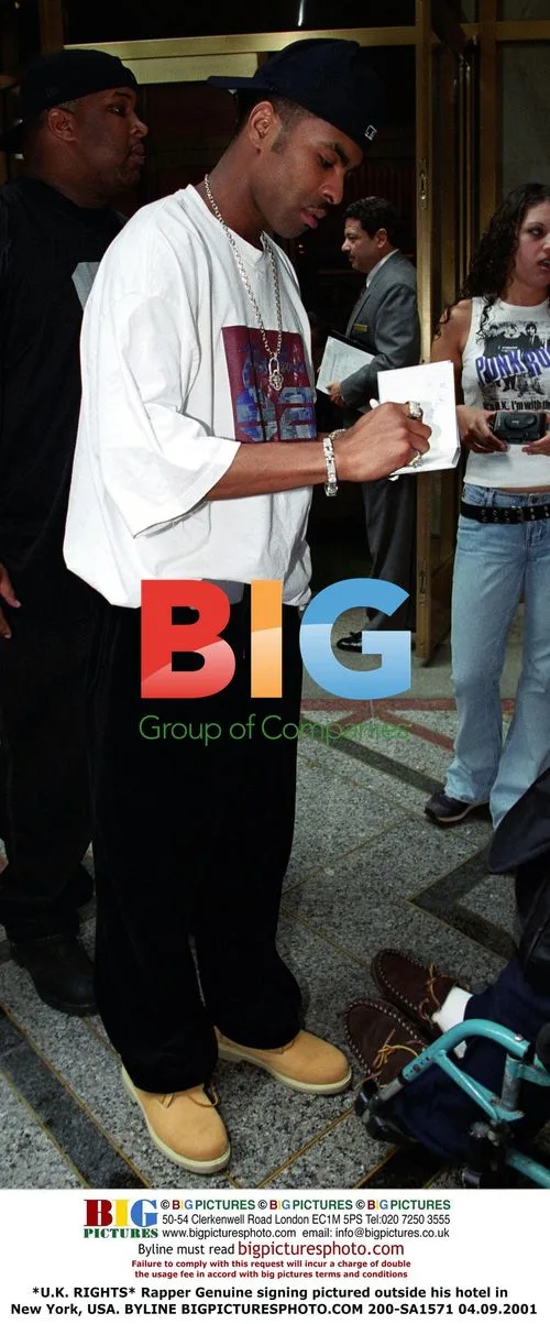Rapper Genuine signing outside hotel in New York