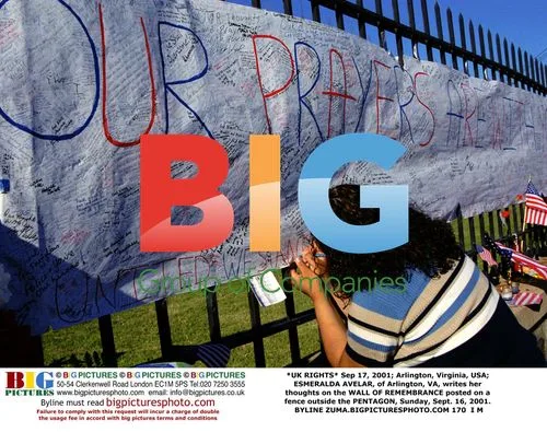 ESMERALDA AVELAR writes on 9/11 memorial wall