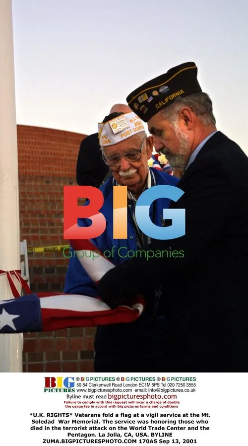 Veterans fold flag at vigil service