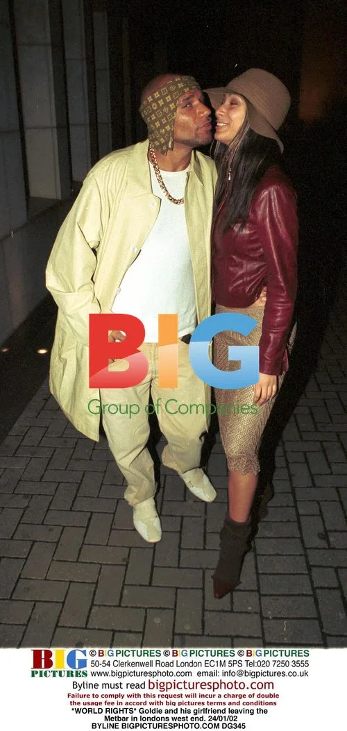 Goldie and girlfriend leaving the Met Bar