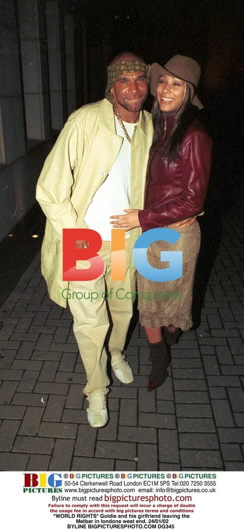 Goldie and girlfriend leaving Met Bar